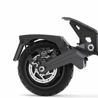 Close-up of the rear wheel and suspension components of the black Ausom DT2 Pro electric scooter featuring a 10-inch tubeless rubber tire and disc brake system.