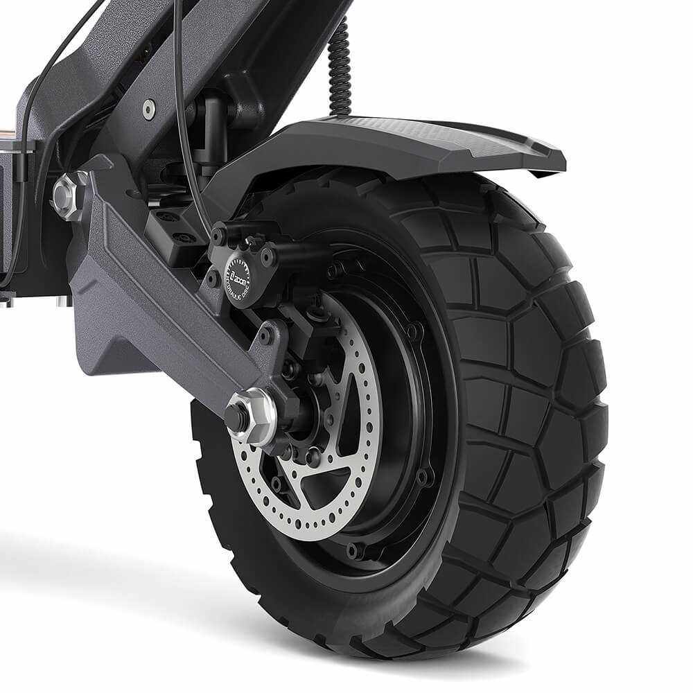 Close-up of the rear 10x3 inch tubeless rubber tire and disc brake on the Ausom DT2 Pro electric scooter